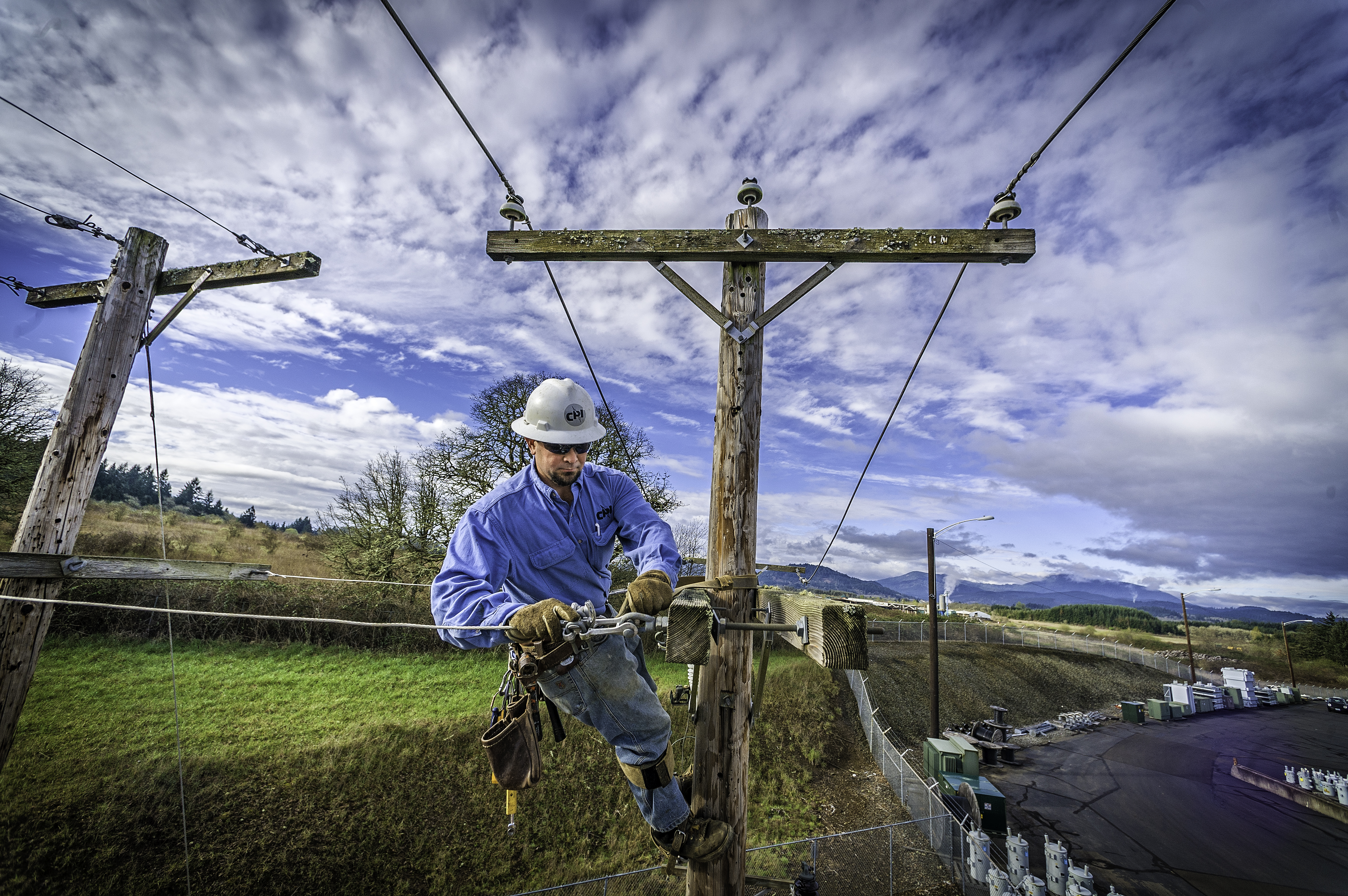 Consumer's Power Lineman Working above ground