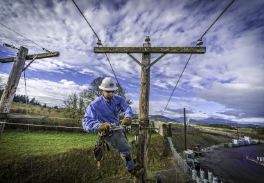 Consumer's Power Lineman Working above ground